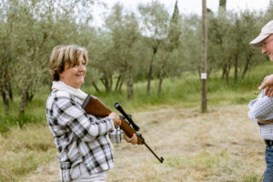 Senior woman at rifle target shooting, Florence, Italy Senior woman at rifle target shooting, Florence, Italy
